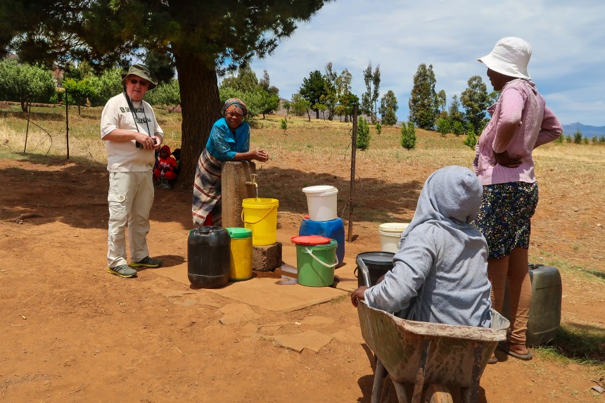 women gather at Ha Raboletsi's communal tap, Roma, Lesotho, Southern Africa, photo by Kelly Benning
